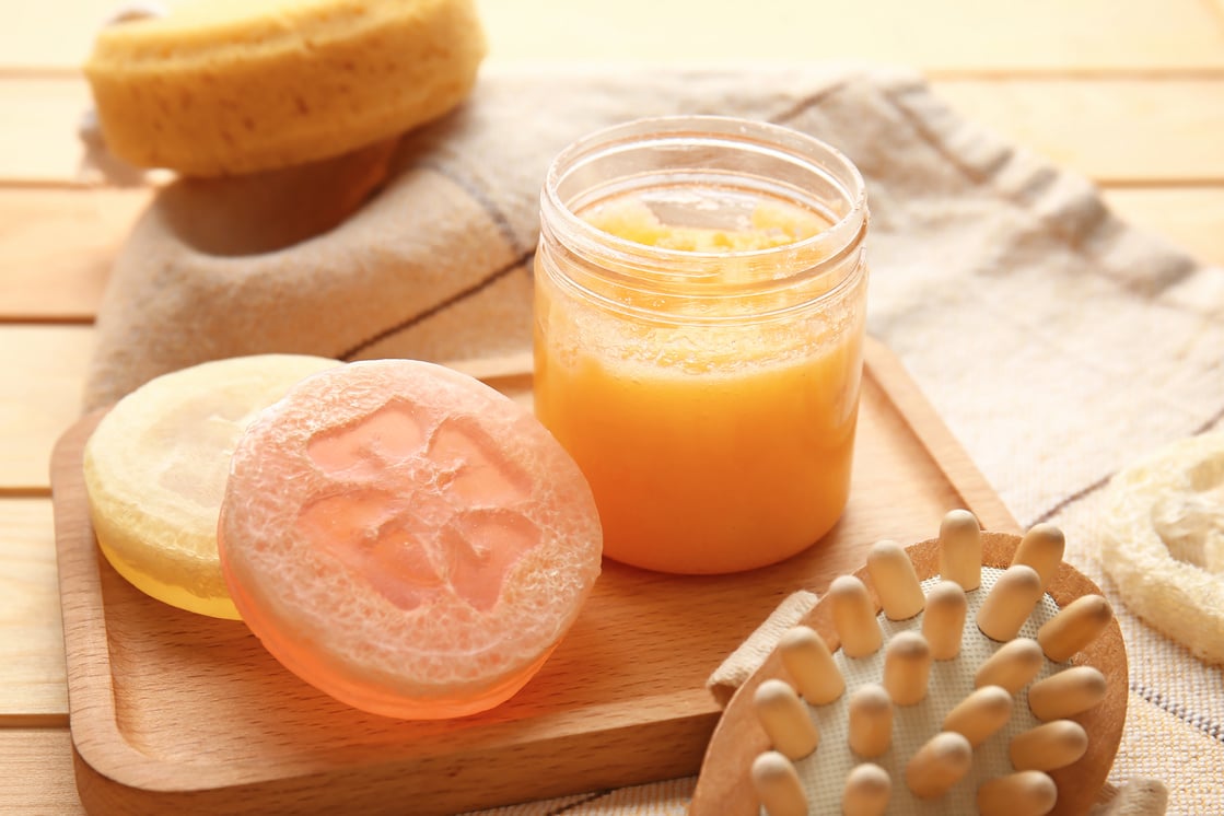 Jar with Sugar Scrub and Soap on Table